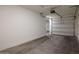 Spacious garage with freshly painted walls and garage door at 3911 S 79Th Ln, Phoenix, AZ 85043