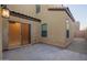 This exterior patio features pavers and a sliding glass door to the interior of the home at 3911 S 79Th Ln, Phoenix, AZ 85043