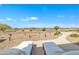 Scenic backyard featuring comfortable lounge chairs and stunning views of the golf course at 3956 N San Marin Dr, Florence, AZ 85132