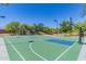 Outdoor basketball court provides recreational space for residents, set against a backdrop of trees and blue sky at 3956 N San Marin Dr, Florence, AZ 85132