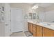 Bathroom featuring a double sink vanity with wood cabinets and white countertops at 3956 N San Marin Dr, Florence, AZ 85132