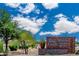 Community signage displaying 'Anthem Poston Butte Golf Club' against a vibrant blue sky with scattered clouds at 3956 N San Marin Dr, Florence, AZ 85132