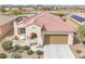 Inviting single-story home with a tile roof, two-car garage, and a charming front patio near the golf course at 3956 N San Marin Dr, Florence, AZ 85132