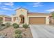 A beautiful stucco home featuring a tile roof and manicured desert landscaping, embodying southwest charm at 3956 N San Marin Dr, Florence, AZ 85132