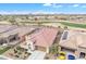 Charming single-story home featuring a desert landscape, tile roof and solar panels on a golf course homesite at 3956 N San Marin Dr, Florence, AZ 85132