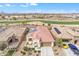 Charming single-story home featuring a desert landscape, tile roof and solar panels on a golf course homesite at 3956 N San Marin Dr, Florence, AZ 85132