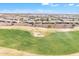 Scenic aerial view of a lush green golf course with the community homesite in the background at 3956 N San Marin Dr, Florence, AZ 85132