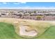 Scenic aerial view of a lush green golf course with the community homesite in the background at 3956 N San Marin Dr, Florence, AZ 85132