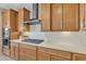 A kitchen featuring wood cabinets, stainless steel appliances, and white subway tile backsplash at 3956 N San Marin Dr, Florence, AZ 85132