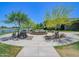 Scenic park area with benches, landscaping, and a calming water feature at 3956 N San Marin Dr, Florence, AZ 85132