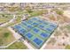 Aerial view of multiple outdoor pickleball courts in a well-maintained park setting at 3956 N San Marin Dr, Florence, AZ 85132