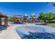 Vibrant community playground features various structures and play areas, providing ample space for to have fun and be active at 3956 N San Marin Dr, Florence, AZ 85132