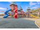 Vibrant playground with colorful slides, towers, and a cushioned safety surface at 3956 N San Marin Dr, Florence, AZ 85132