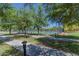 Shady tennis courts with mature trees offer a cool recreational space for community residents to stay fit and active outdoors at 3956 N San Marin Dr, Florence, AZ 85132