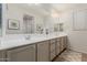 The bathroom includes a double sink vanity and a large mirror with overhead lighting at 4107 N Hawthorn Dr, Florence, AZ 85132