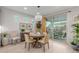 Charming dining room with a modern chandelier, sliding glass doors, and a view of the outdoor patio at 4107 N Hawthorn Dr, Florence, AZ 85132