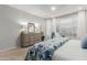 The main bedroom features a large dresser and light-filled windows at 4107 N Hawthorn Dr, Florence, AZ 85132