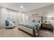 The main bedroom features a decorative headboard, ceiling fan, and light-filled windows at 4107 N Hawthorn Dr, Florence, AZ 85132