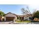 Charming single-story home featuring a well-manicured lawn, desert landscaping, and a two-car garage at 4217 E Edgemont Ave, Phoenix, AZ 85008