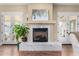 Living area fireplace with a white marble surround and elegant mantel at 4217 E Edgemont Ave, Phoenix, AZ 85008