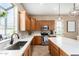 Well-lit kitchen offering stainless steel appliances, quartz countertops and plenty of cabinet space at 4217 E Edgemont Ave, Phoenix, AZ 85008