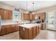 Beautiful kitchen featuring quartz countertops, pendant lights, stainless appliances, and ample cabinet space at 4217 E Edgemont Ave, Phoenix, AZ 85008