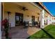 Covered patio perfect for outdoor dining, featuring a ceiling fan and stone flooring at 4217 E Edgemont Ave, Phoenix, AZ 85008