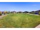 Great view of a green community space with sidewalks and residential houses at 4340 W Jeanette Ln, San Tan Valley, AZ 85144