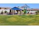 Shaded picnic area with playground featuring climbing equipment, a slide, and a covered seating area at 4340 W Jeanette Ln, San Tan Valley, AZ 85144