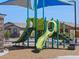 Vibrant playground with slides and stairs, designed for entertainment, next to the stone wall at 4354 W Jeanette Ln, San Tan Valley, AZ 85144