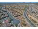 Expansive aerial shot of a desert community showcasing the neighborhood layout, streets, and tile roofed homes at 4424 N Potomac Dr, Florence, AZ 85132