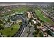 Aerial view of a Primary-planned community featuring a golf course and recreational facilities at 4424 N Potomac Dr, Florence, AZ 85132