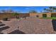 Large backyard with rock landscaping, mature bushes, and a block wall at 4424 N Potomac Dr, Florence, AZ 85132