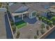 Aerial view of backyard featuring covered patio, synthetic grass, and low maintenance desert landscaping at 4424 N Potomac Dr, Florence, AZ 85132