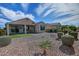 Well-maintained backyard featuring rock landscaping, artificial turf, and mature hedges at 4424 N Potomac Dr, Florence, AZ 85132