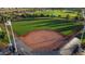 Well-maintained ball field, perfect for community sports and recreation, with lush green outfield and covered seating at 4424 N Potomac Dr, Florence, AZ 85132