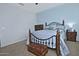 Bedroom with wood furnishings, soft blue walls and carpet flooring offers a cozy retreat at 4424 N Potomac Dr, Florence, AZ 85132