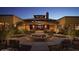 Exterior of a community recreation center featuring a welcoming entrance, desert landscaping, and inviting benches at 4424 N Potomac Dr, Florence, AZ 85132