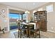 Dining room with elegant wood table, chairs, and a large china cabinet at 4424 N Potomac Dr, Florence, AZ 85132