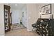 Welcoming entryway with tile floors, decorative cabinet, and ample natural light at 4424 N Potomac Dr, Florence, AZ 85132