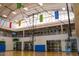 Indoor basketball court and second-floor exercise equipment at 4424 N Potomac Dr, Florence, AZ 85132