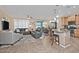 Spacious living room with plantation shutters offering ample light with combined kitchen and dining at 4424 N Potomac Dr, Florence, AZ 85132