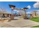 Playground entrance with welcoming 'Adventure Playground' signage, colorful play structures, and landscaped surroundings at 4424 N Potomac Dr, Florence, AZ 85132