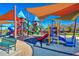 Shaded playground featuring a variety of colorful slides, climbing structures, and soft surfaces for safe play at 4424 N Potomac Dr, Florence, AZ 85132