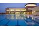 Outdoor pool with clear blue water reflecting the building's facade and surrounding amenities at 4424 N Potomac Dr, Florence, AZ 85132