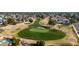 Aerial view showcasing a lush golf course surrounded by well-maintained residences and mature landscaping at 4606 W Continental Dr, Glendale, AZ 85308