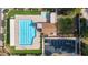 Overhead view of a clean community pool, spa, clubhouse, and ample parking, surrounded by green space at 4606 W Continental Dr, Glendale, AZ 85308