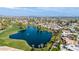 Beautiful aerial view of lake with lush green spaces near homes in a suburban neighborhood at 4606 W Continental Dr, Glendale, AZ 85308