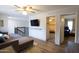 Comfortable living room featuring a large TV and views into other rooms at 4606 W Continental Dr, Glendale, AZ 85308