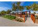 Inviting outdoor patio area with wooden pergolas, perfect for dining and socializing under string lights at 4606 W Continental Dr, Glendale, AZ 85308